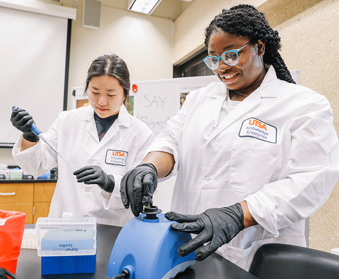 Two students working in a lab