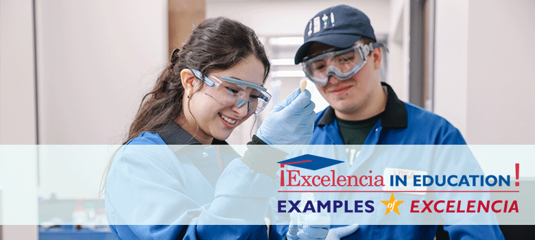 Two students working in a lab with a Excelencia in Education banner