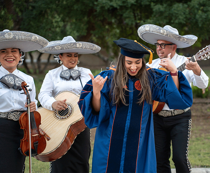 Student celebrating at doctoral hooding ceremony